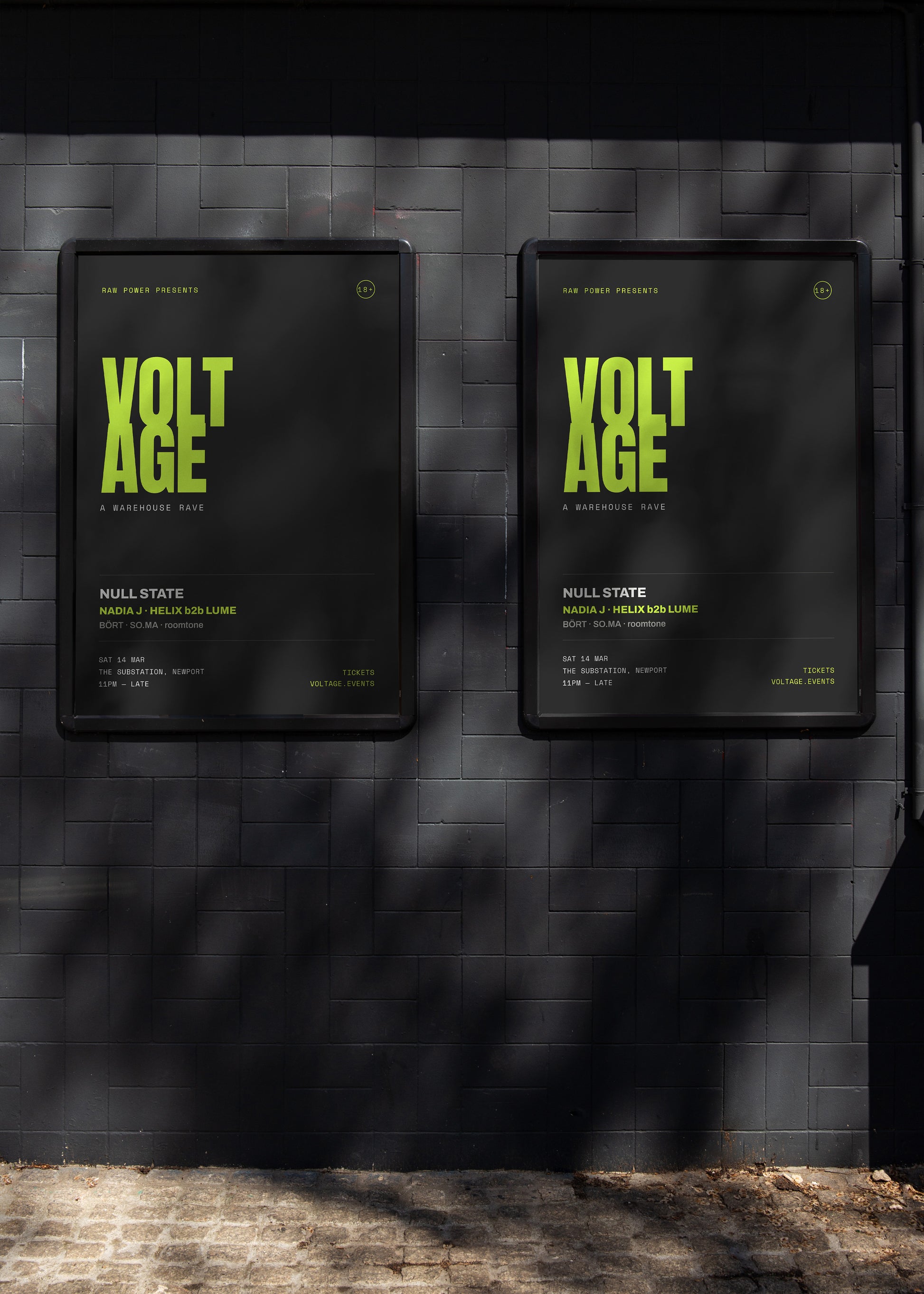 Two black signs titled 'VOLTAGE' on a textured wall.